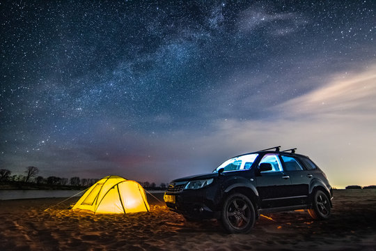 Nikolaevka, Russia - May 04, 2019: Tourist Tent And Car Under Night Sky