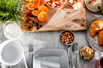 Breakfast on the table on a beautiful holiday morning with free space for an advertising product