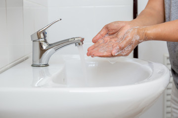 Man Washing hands with for corona virus prevention.