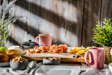 Breakfast on the table on a beautiful holiday morning with free space for an advertising product