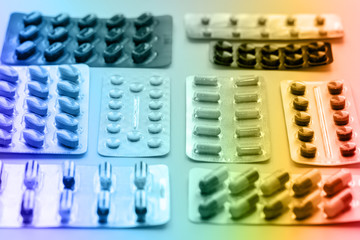 Vitamins and pills blister packs, close-up.