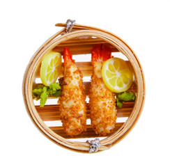 Plastic crispy fried shrimps in tempura batter in a wicker round bowl. Japanese fish dish. model...