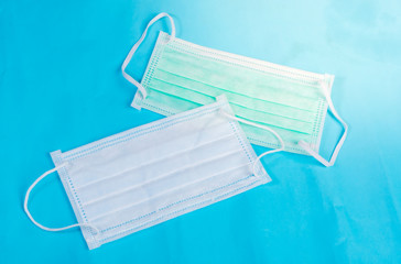 Anti virus protection mask standard to prevent corona COVID-19 flu, dust on a blue background...