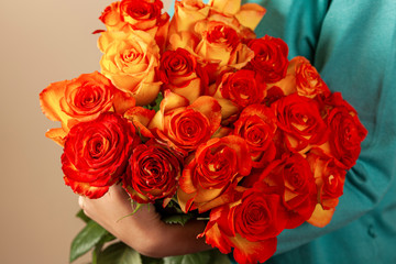 women hand holding flowers bouquet