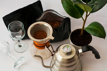 White background, flower in pot, strong black natural coffee in glassware prepared by alternative...