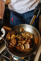 Portion of mushrooms, vegetables and meat