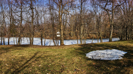 Park landscape.Spring landscape in the park of the estate of the Pushkin family. Visible trees with...