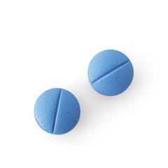 Blue pills isolated on white background