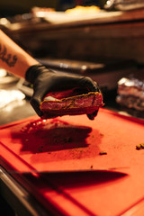 Grilled meat with chef in the kitchen