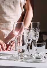 wine glasses sunlight shadow sun wine different glare hand woman white black background