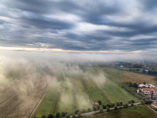 Clouds and fog over the town, Tuscany