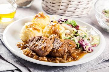 Braised pork loins with onion sauce