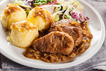 Braised pork loins with onion sauce