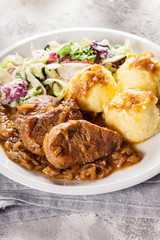 Braised pork loins with onion sauce