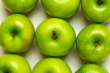 background of green apples close-up

