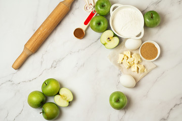ingredients for baking apple pie on a white background and place for text
