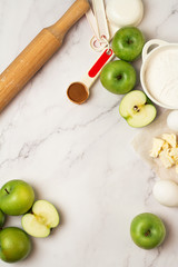 ingredients for baking apple pie on a white background
