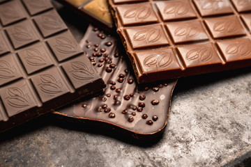Chocolate bar on the rustic background. Selective focus. Shallow depth of field.