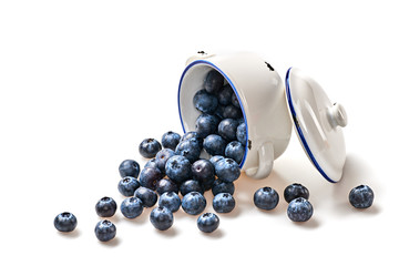 Blueberry in ceramic bowl isolated on white. Fresh blueberry closeup, healthy diet nutrition concept. Ripe organic bilberry, vegan meal. Juicy blueberries background.