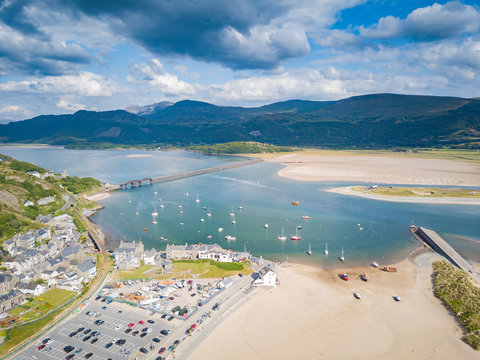 Aerial view of Barmouth Bridge and Afon Mawddach Estuary with Cadair Idris Mountains in background, Snowdonia, Wales, UK