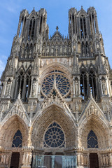 Fototapeta premium Low angle view at the front of cathedral Notre Dame in Reims