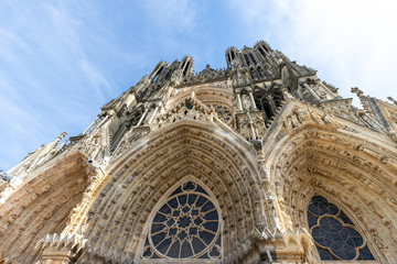 Low angle view at the front of cathedral Notre Dame in Reims
