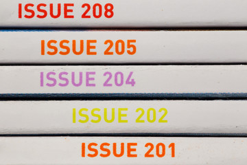 Macro close up view of issue number in red and purple across horizontal lines