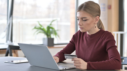 Young Woman Busy in Online Shopping on Laptop