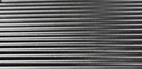 Obraz premium New grill metal surface, background and texture, side view