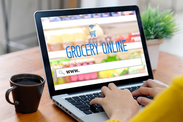 Grocery online shop to order food delivery from supermarket, Woman hands using laptop computer for shopping grocery store online web, www. on search bar 