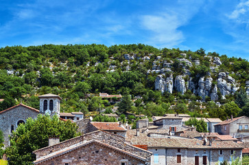 Fototapeta na wymiar Stone homes and belfry in the medieval town of Vogue in France.