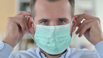 Close Up of Young Man Wearing Face Mask
