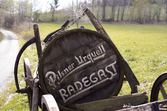 Celadna, Czech Republic / Czechia - April 14, 2017: Pilsner urquell and Radegast - advertisement for brewery and brewing company.	 Signboard made of rustic wood. Very shallow focus.