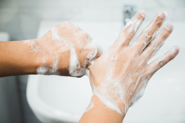 Close up Male hands washing hands with soap. for corona virus prevention.