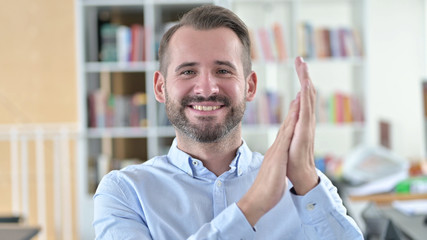Portrait of Cheerful Young Man Clapping, Applauding