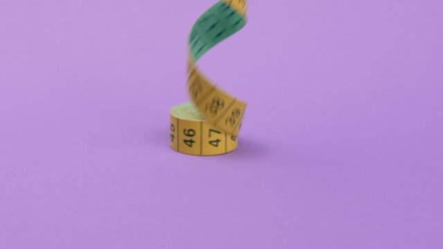 Tape the centimeter on a purple background.