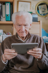 Positive Senior using Digital Tablet