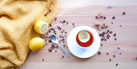 tea with lemons on a wooden table. Beautiful background mockup