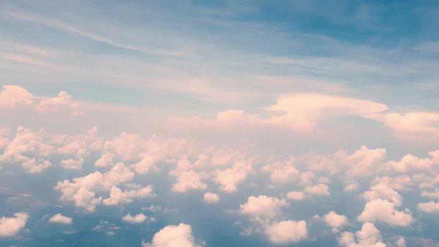 Aerial flying over clouds in the blue sky, wide angle view