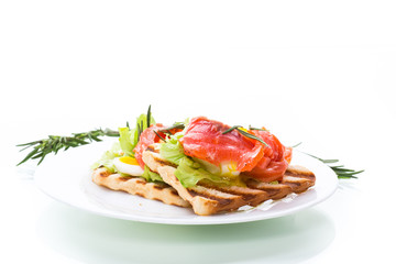 fried bread toast with salad leaves and salted red fish