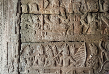 Carved gallery with royal entertainment, musicians with instruments on the 12th century bas-relief of Bayon temple, Cambodia. Historical landmark in Angkor. UNESCO world heritage site