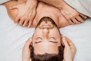 Fototapeta na wymiar Man enjoying head massage.