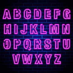 Neon light alphabet on blue brick wall background