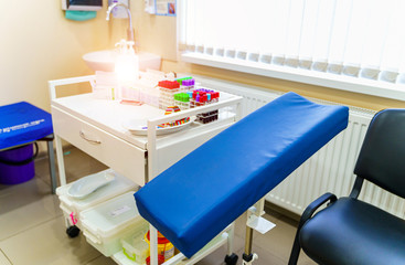 Rack of blood tubes test for analysis in the laboratory of hematology. Pneumonia diagnosing. COVID-19 and coronavirus identification. Pandemic. Assistance in scrabs with medicine dropper.