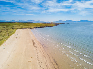 Aerial view of Aberffraw Bay and Snowdonia Mountains, Ty Croes, Anglesey, Wales, UK