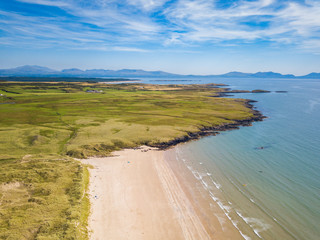 Aerial view of Aberffraw Bay and Snowdonia Mountains, Ty Croes, Anglesey, Wales, UK