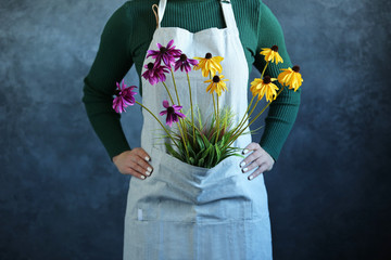 Woman in apron with flowers