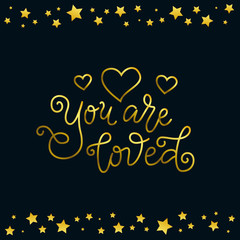 Fototapeta na wymiar Modern calligraphy lettering of You are loved in golden with hearts on dark background