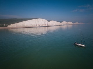 Aerial view of  Seven Sisters Cliffs and Yacht, East Sussex, England