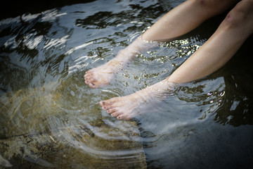 Bare feet soaked in water